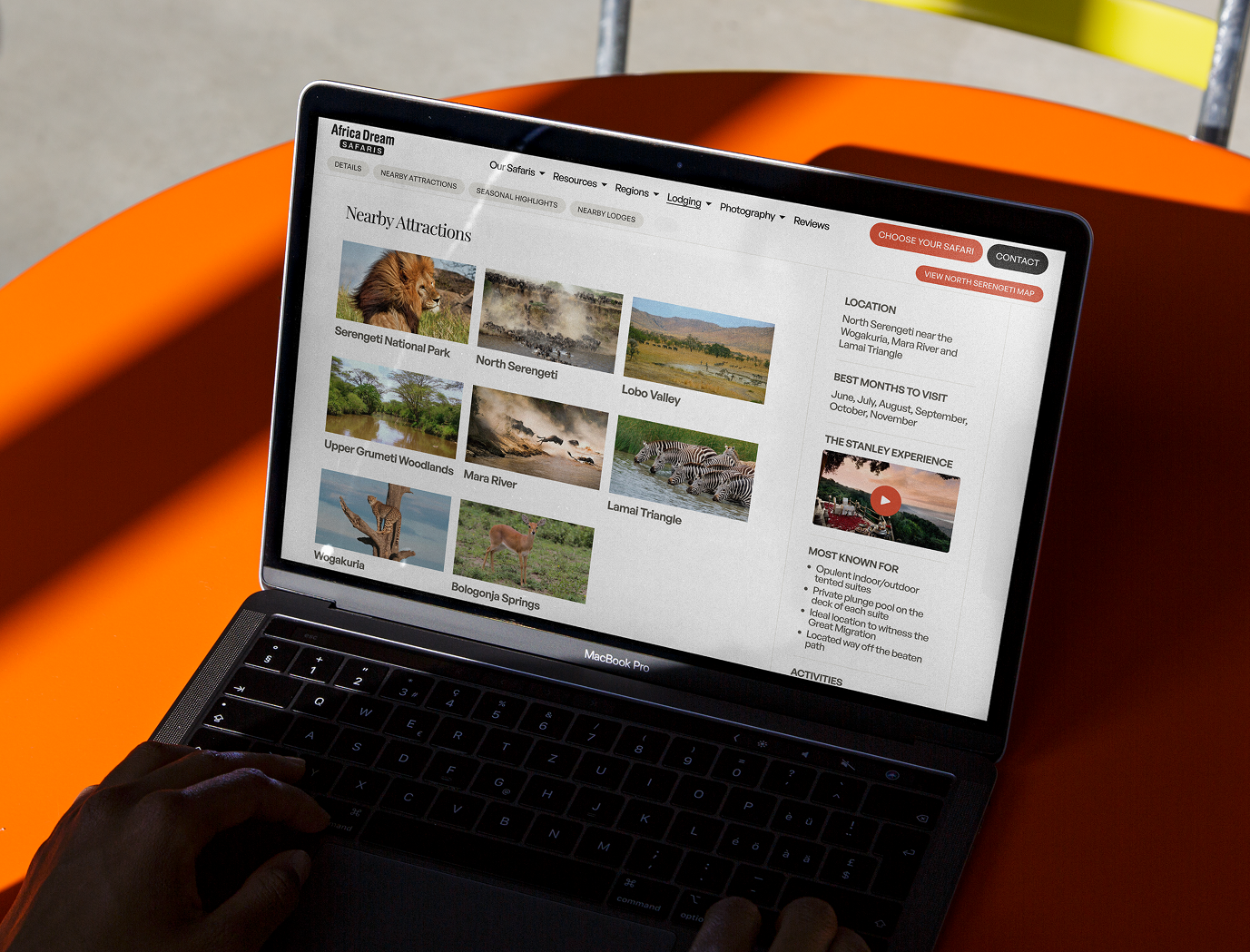 Africa Dream Safaris regional attractions page on laptop